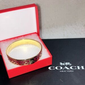 Coach Signature pink and gold bangle